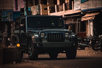 a jeep is parked on the side of the road