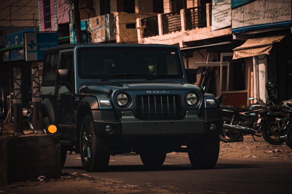 a jeep is parked on the side of the road