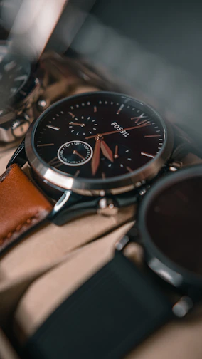 Close-up of a classic men's luxury wristwatch with a leather strap and intricate dial details.