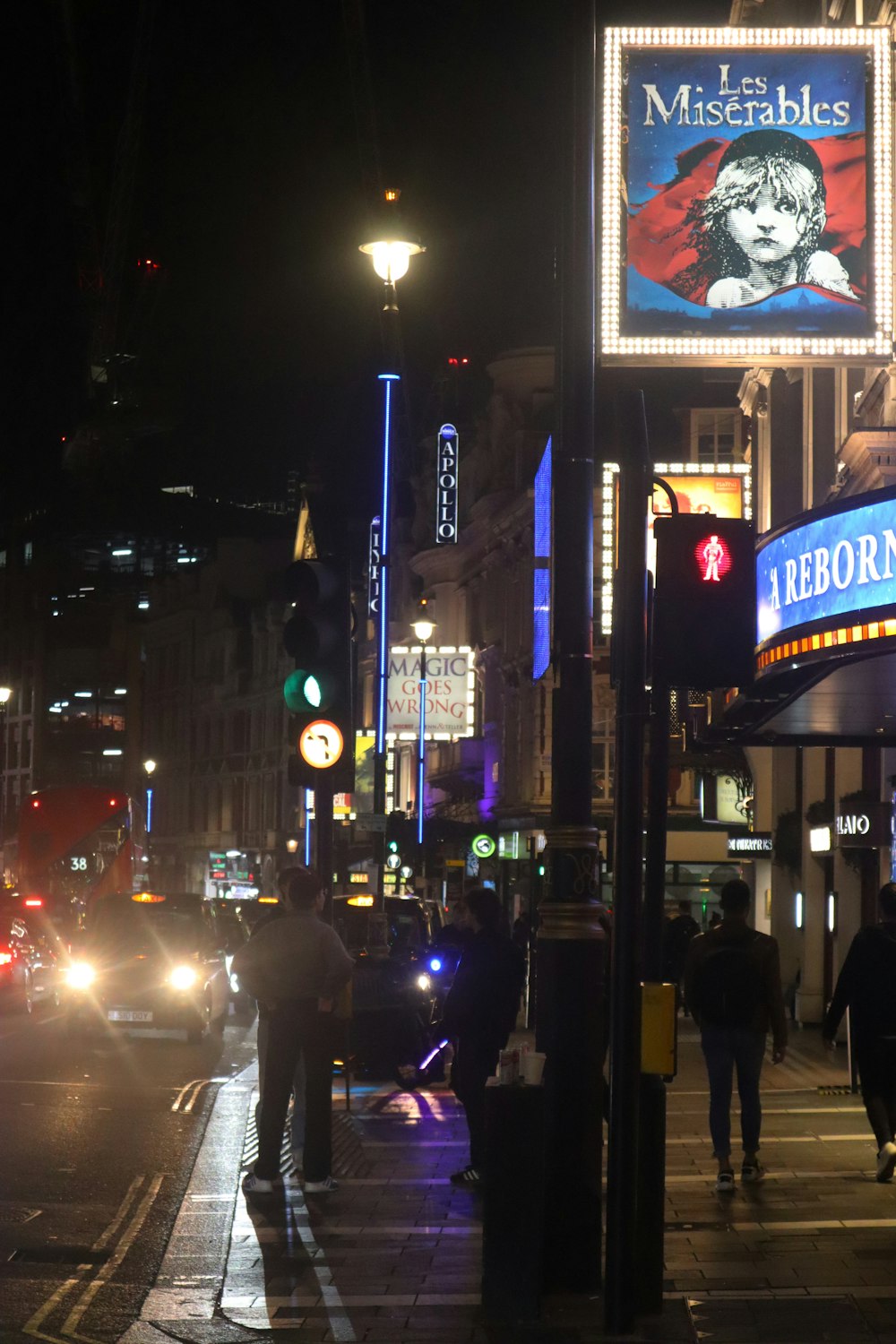 a close up of a busy city street at night