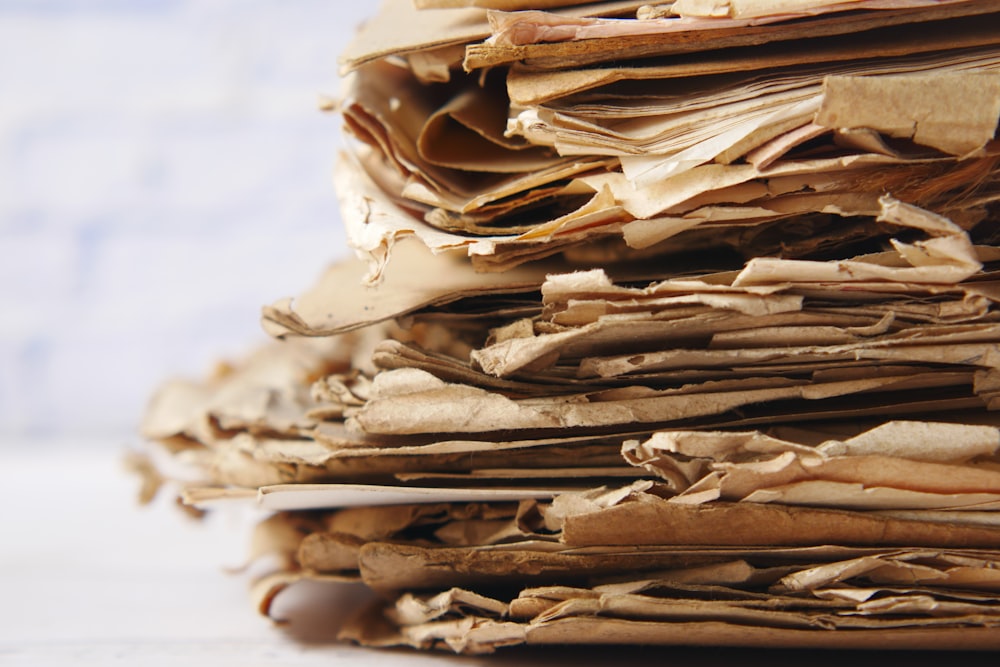 a close up of a pile of paper on a table