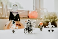 a group of small toy figurines sitting on top of a table