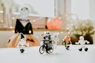 a group of small toy figurines sitting on top of a table