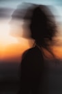 a blurry photo of a woman's face and hair