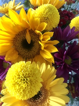 A colorful seasonal bouquet featuring sunflowers, daisies, and wildflowers bursting with natural charm.