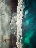 an aerial view of a beach and ocean