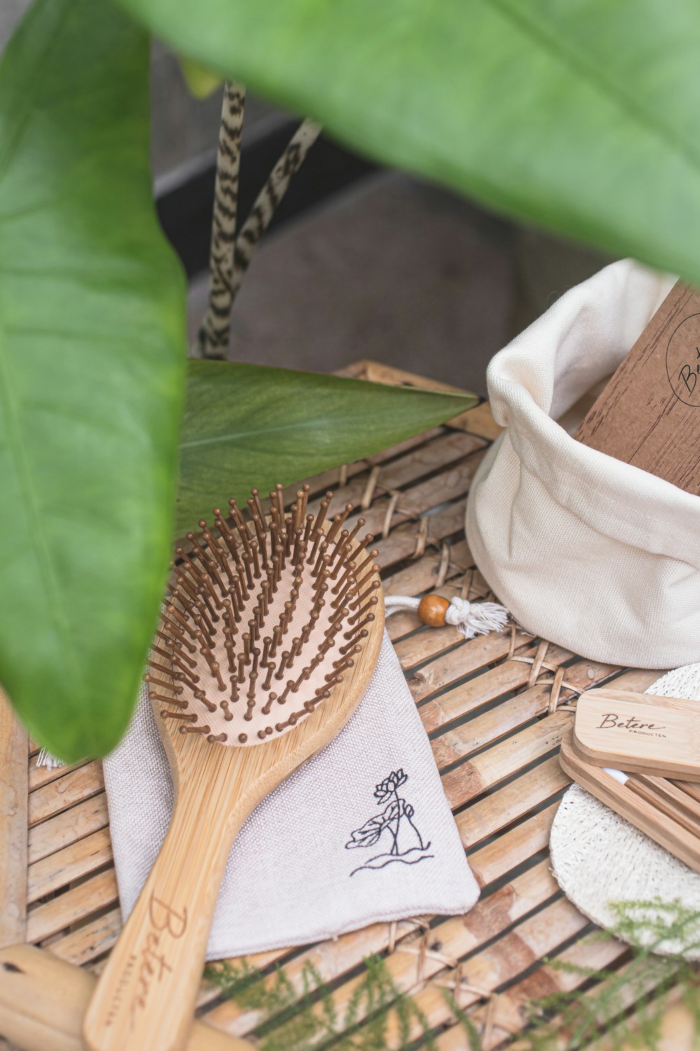 a bamboo brush sitting on top of a bamboo table