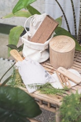 a bamboo table topped with wooden utensils and a bag