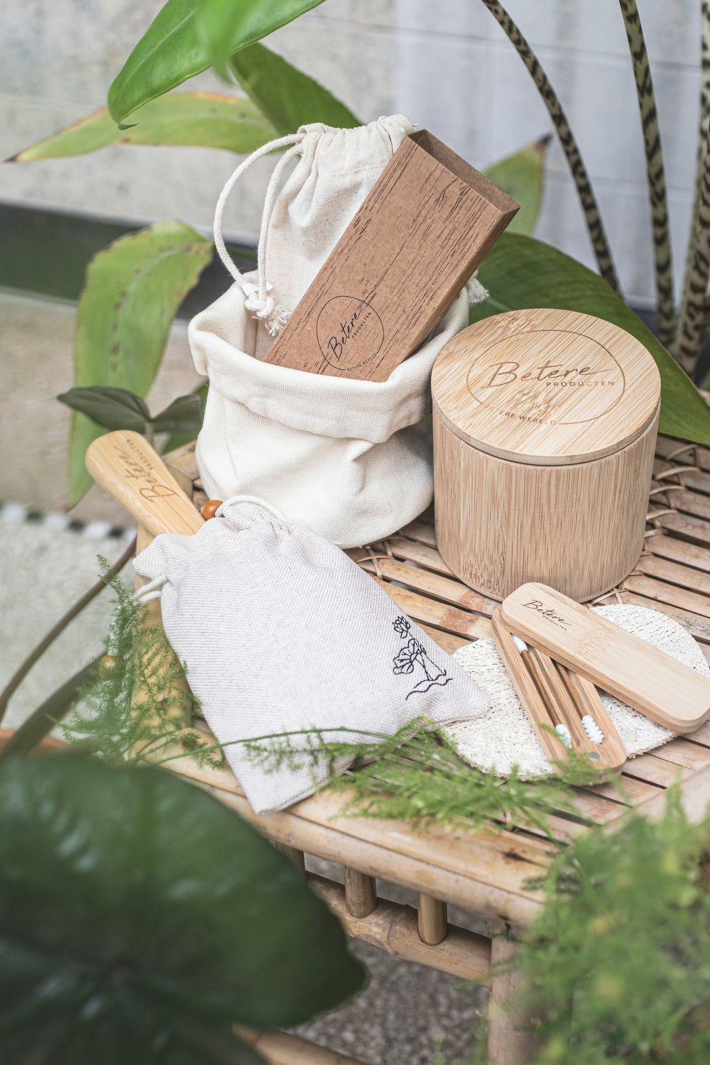 a bamboo table topped with wooden utensils and a bag