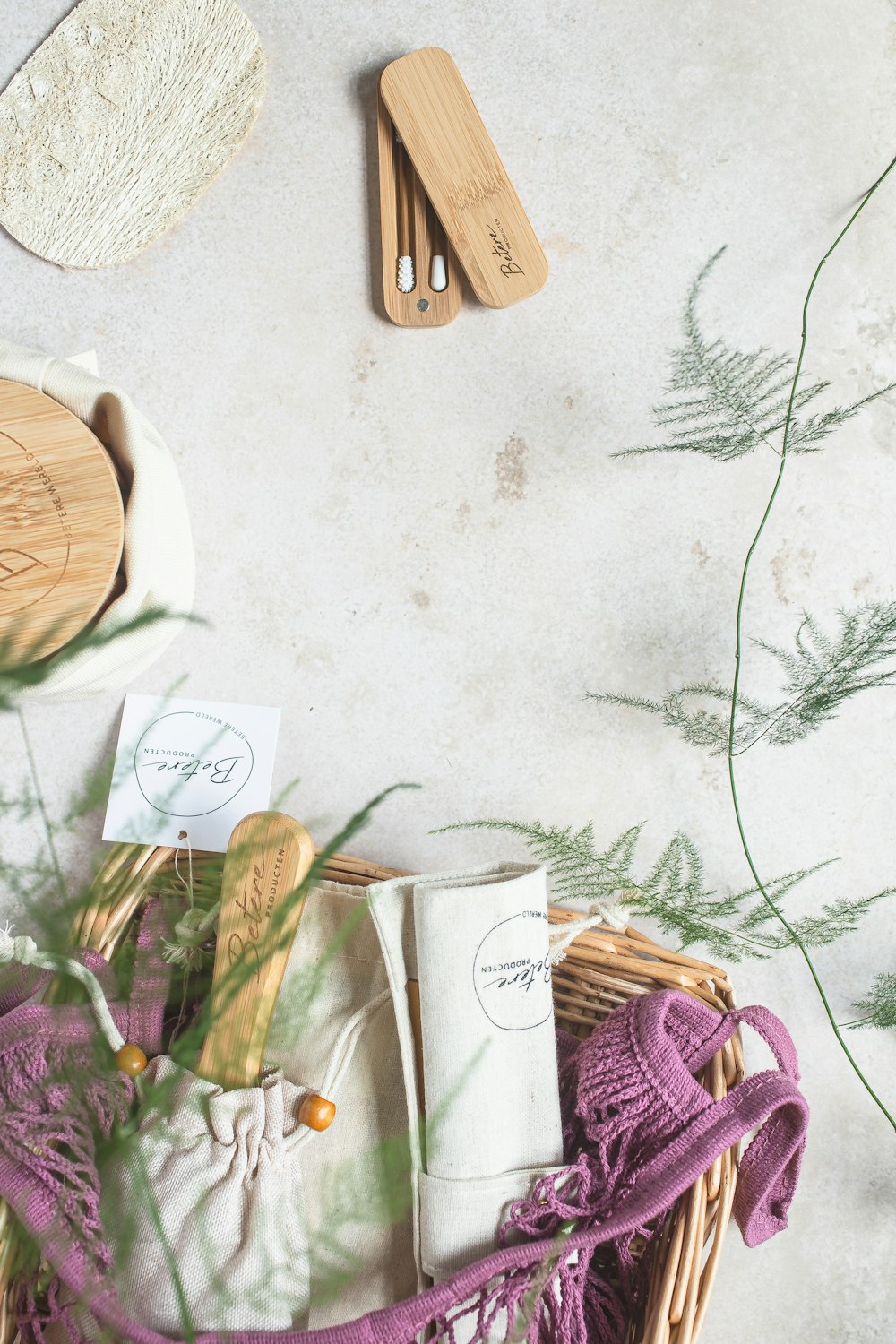 a wicker basket filled with items next to a plant