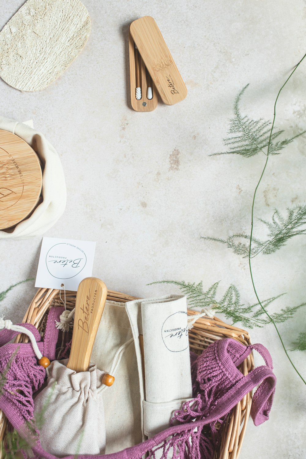 a wicker basket filled with wooden utensils