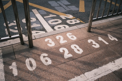 a parking lot with numbers painted on the ground