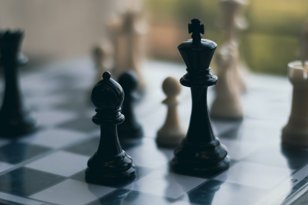 a group of chess pieces sitting on top of a chess board