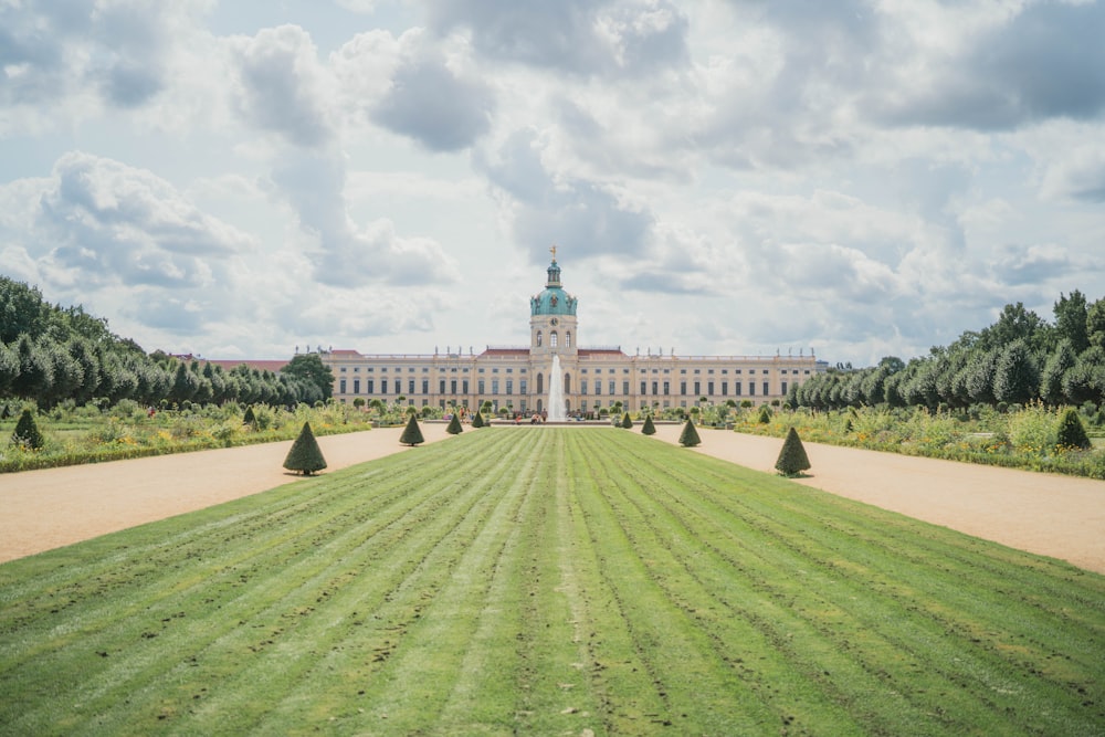 a large building with a large lawn in front of it