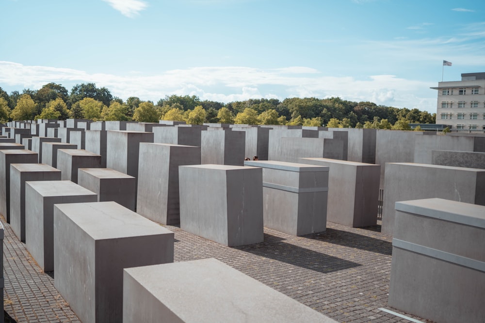 a large group of cement blocks sitting on top of a brick floor