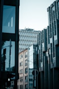 a city street with tall buildings in the background