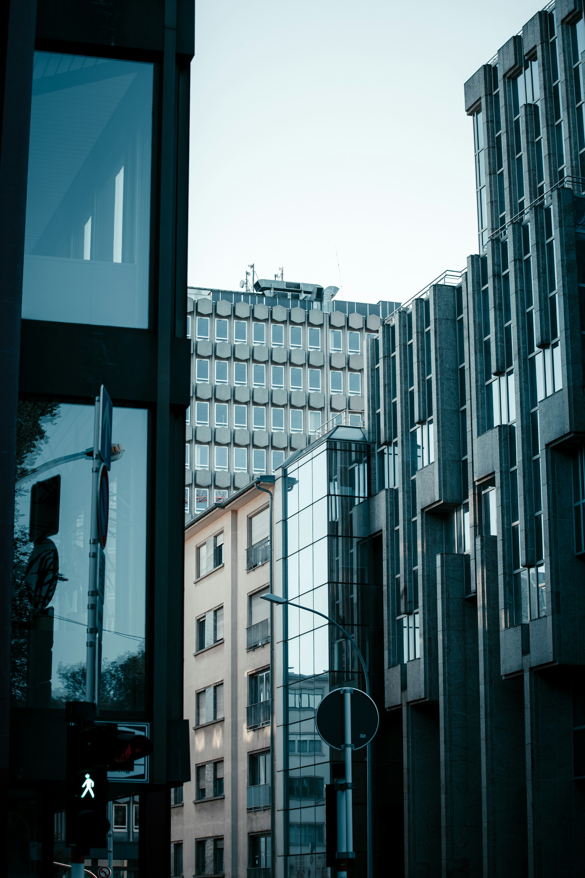 a city street with tall buildings in the background