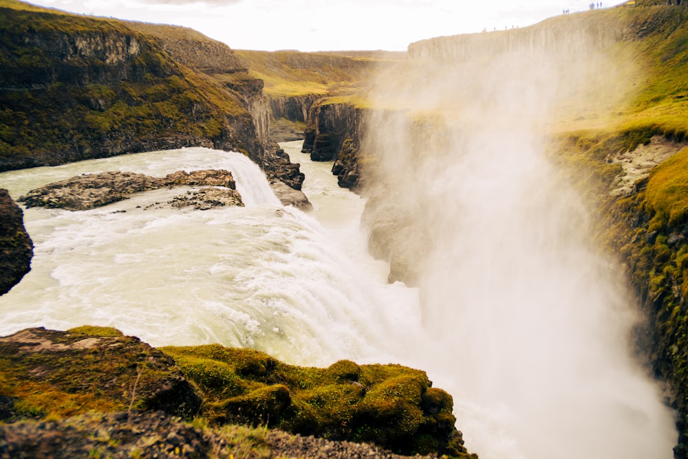 a large waterfall with water coming out of it