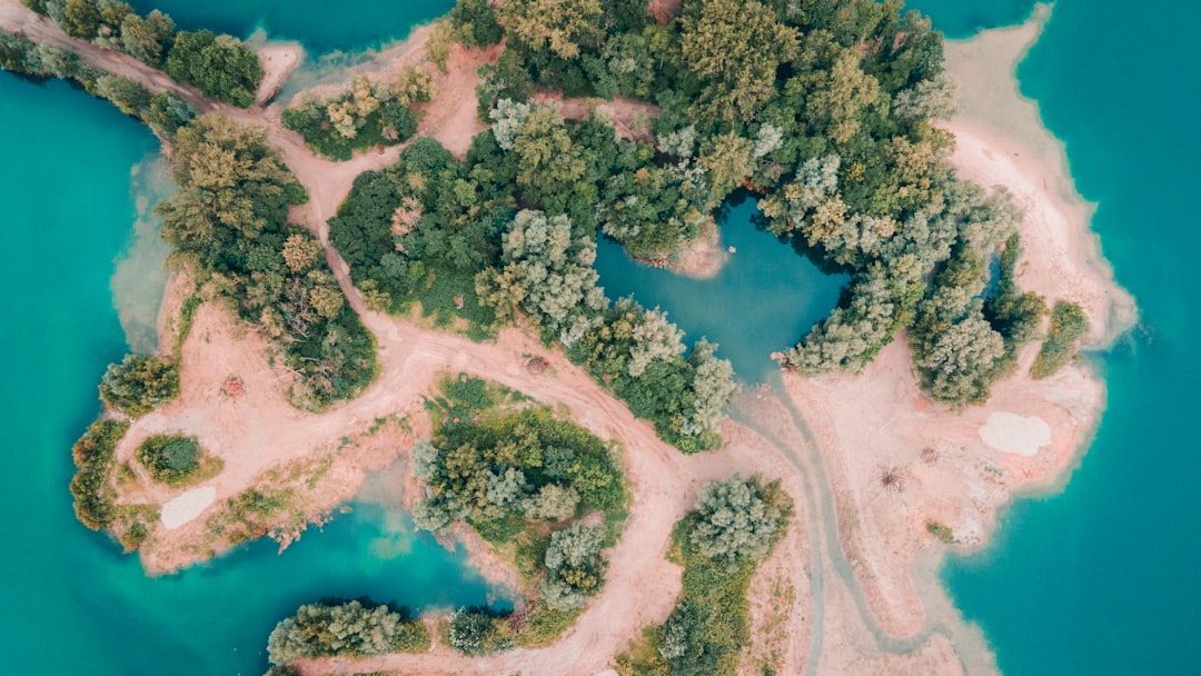 an aerial view of an island in the middle of the ocean,