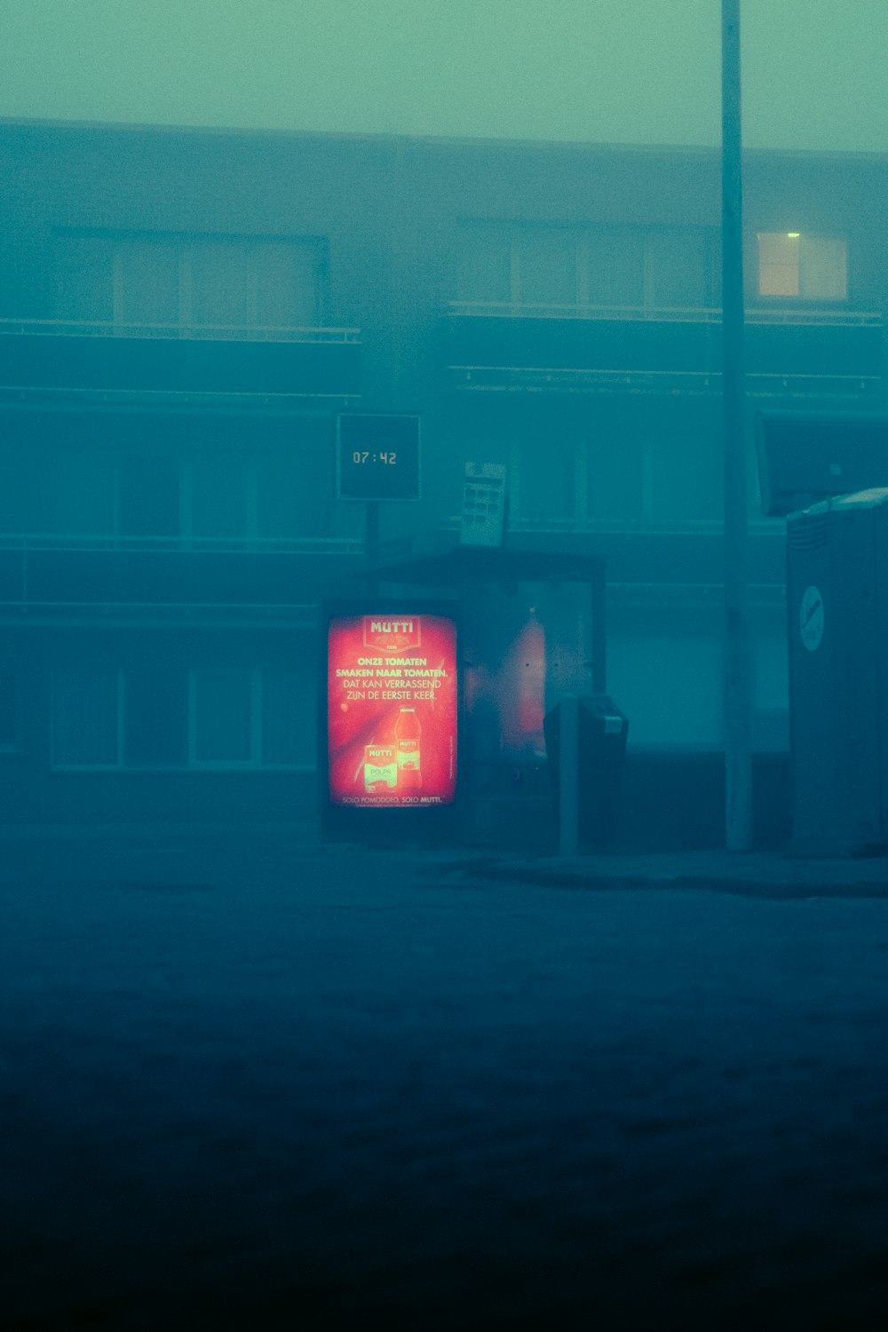 a red television sitting on the side of a road