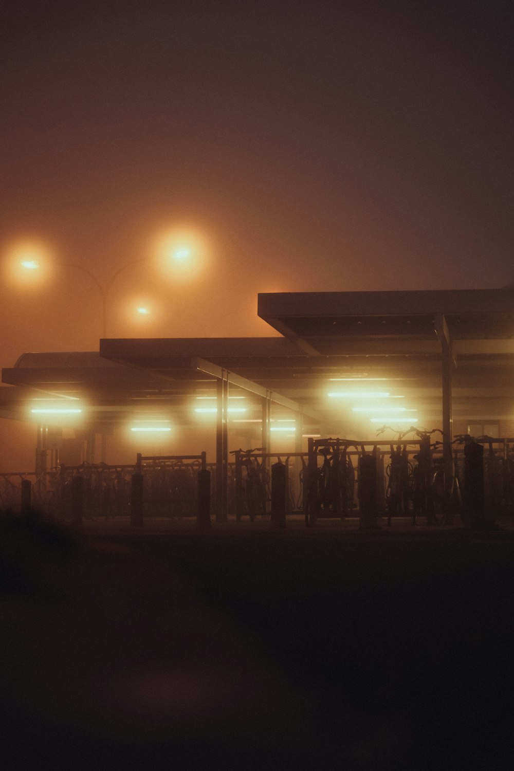 a foggy night at a gas station