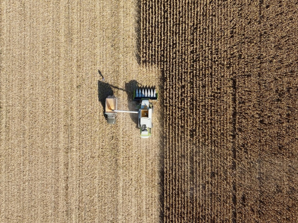 an aerial view of a tractor in a field