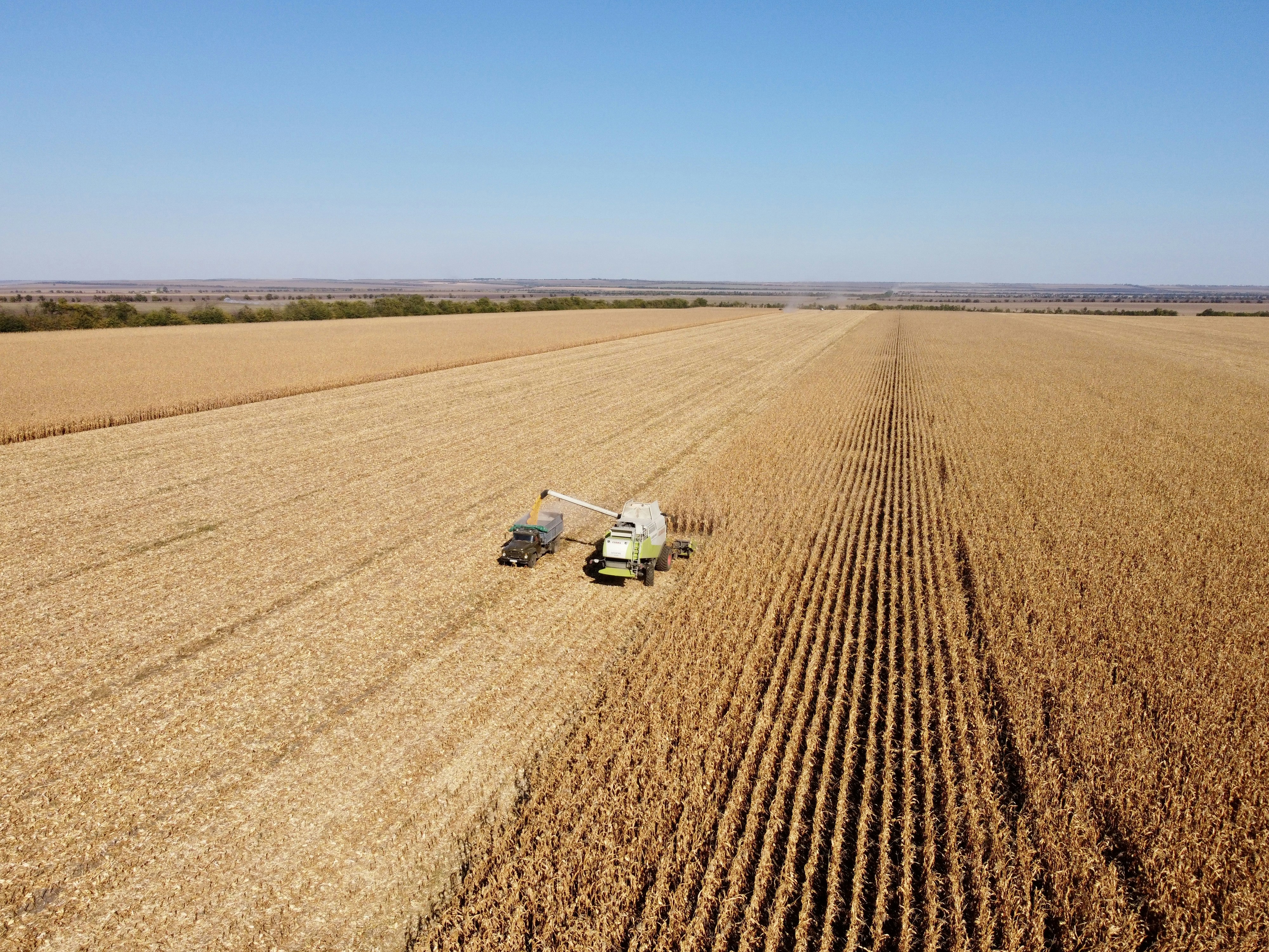 a tractor is driving through a large field