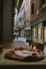 A cozy street scene in Paperino village with locals chatting near small shops.