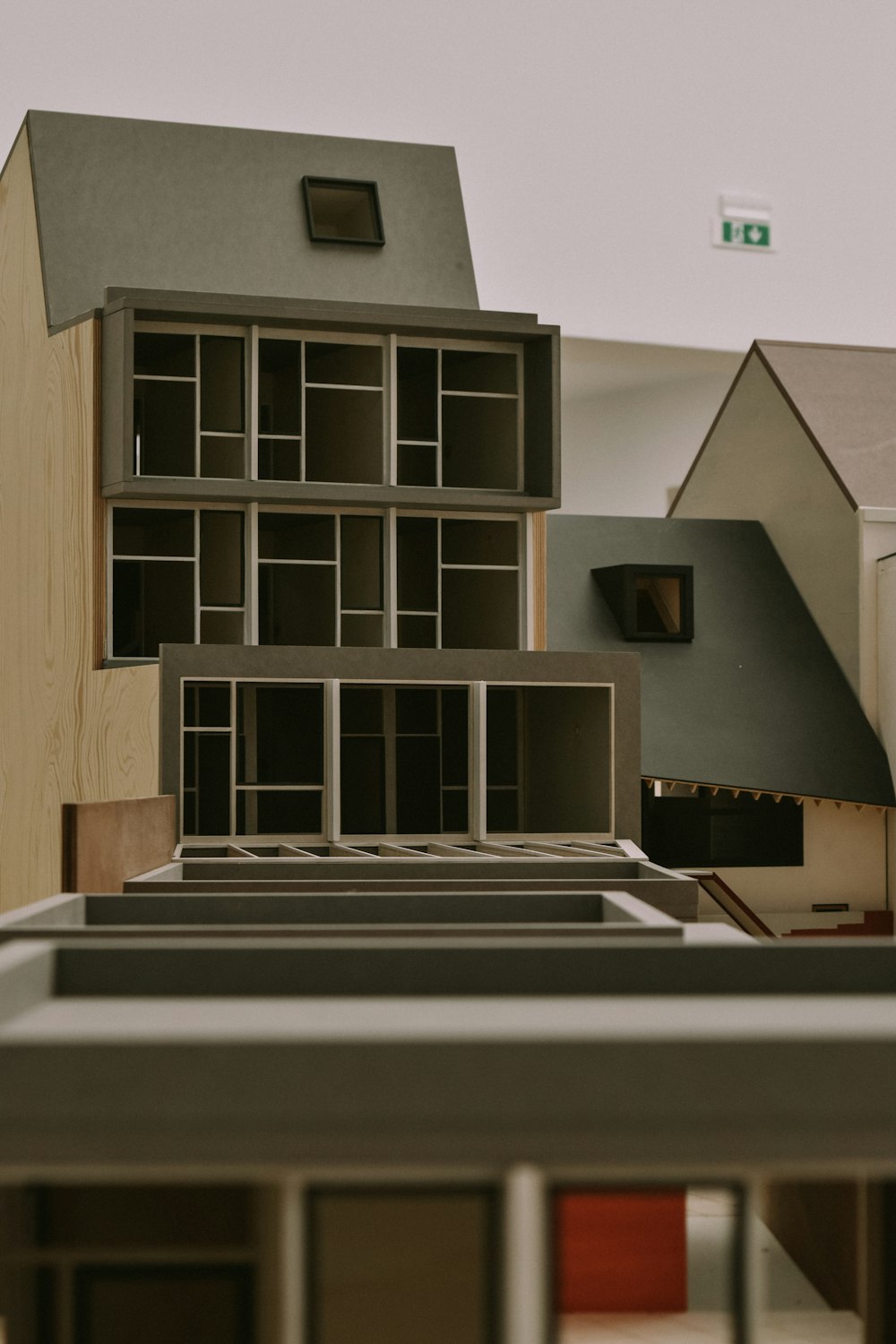 a model of a house is shown in the foreground