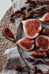 a plate of sliced figs on a table