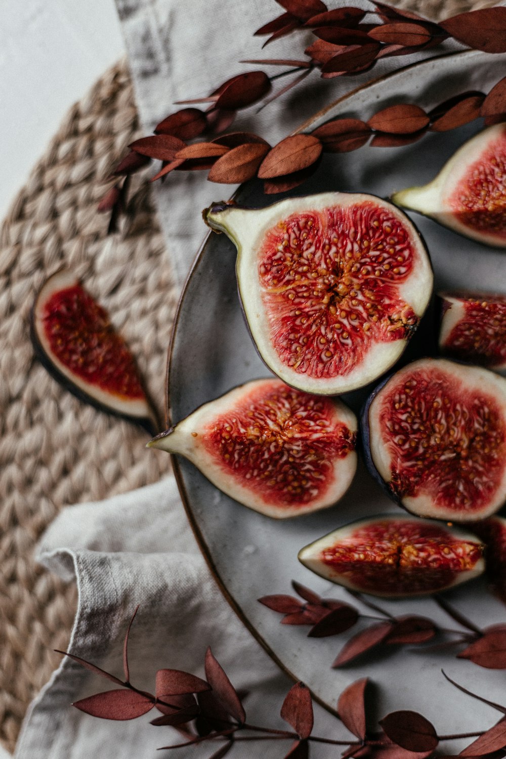 a plate of sliced figs on a table