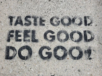 the words taste good, feel good, do good written in black ink on a