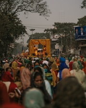 a large group of people walking down a street