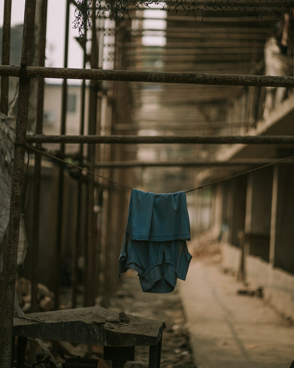 a blue shirt hanging on a clothes line