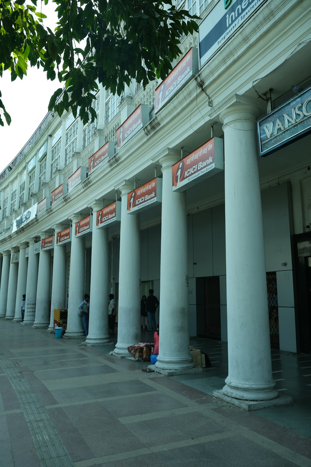 a group of people standing outside of a building