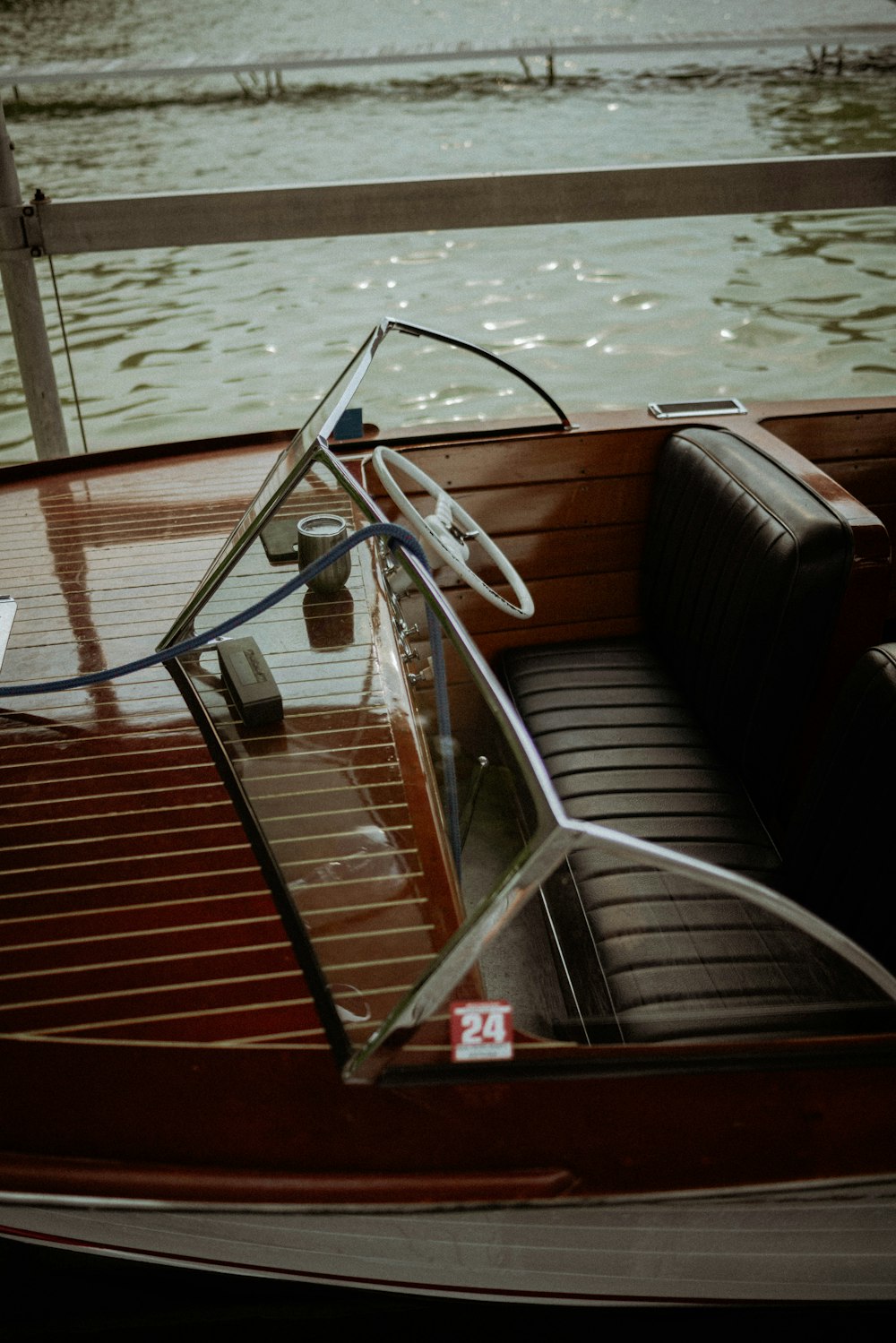 the inside of a boat with a steering wheel