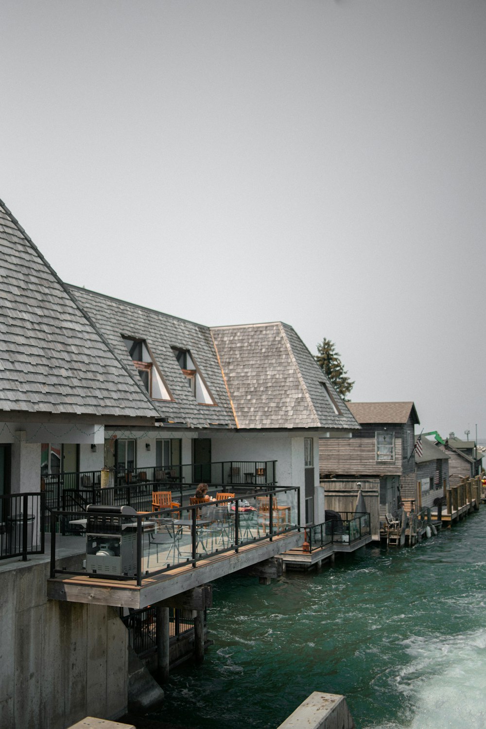 a row of houses next to a body of water