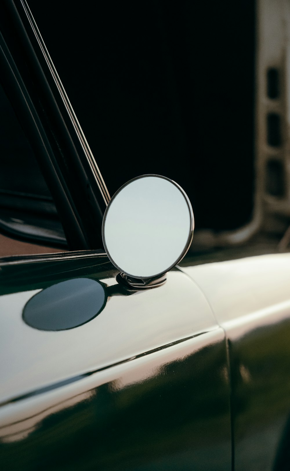 a close up of a mirror on a car