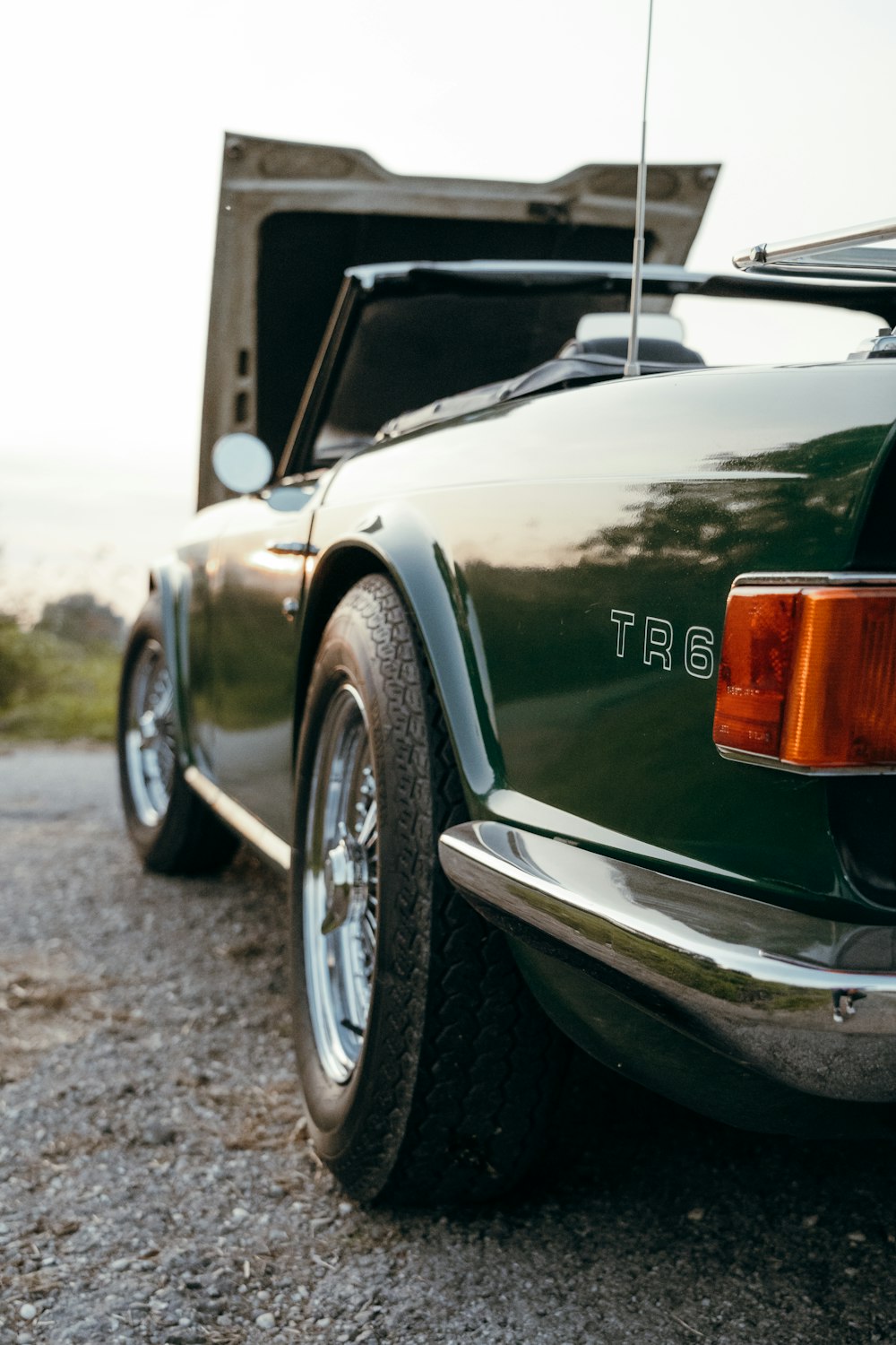 the back end of a green sports car