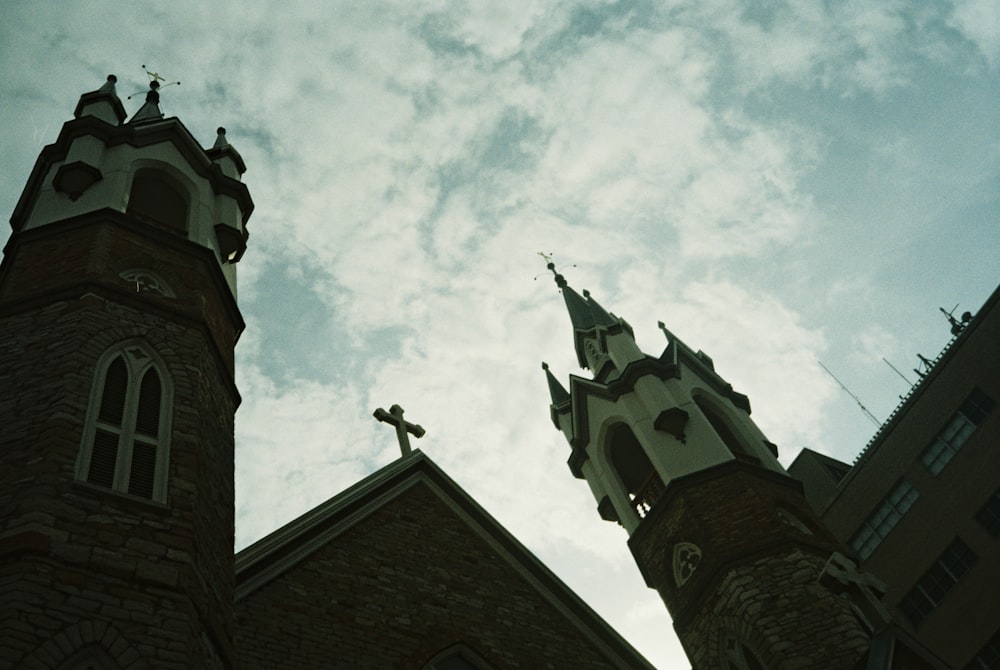 a church steeple against a cloudy sky