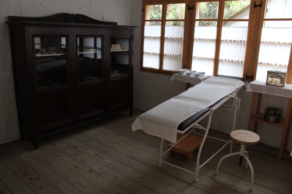 an ironing board in a room with wooden floors