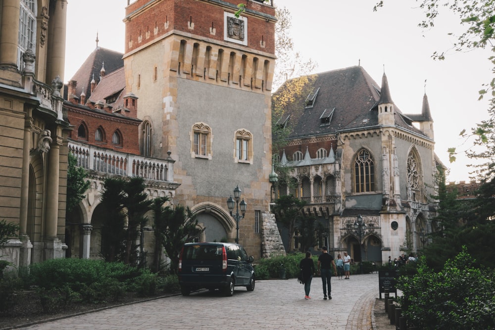 a car parked in front of a large building