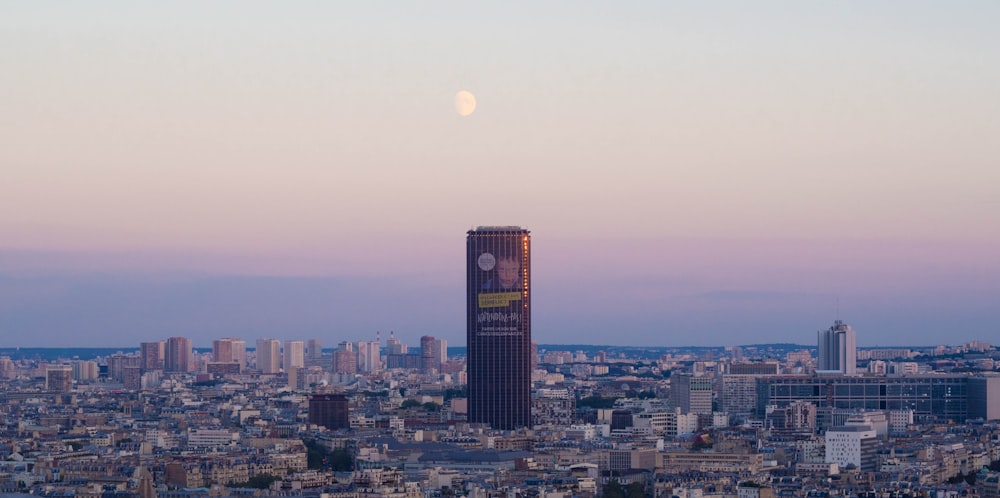 a tall clock tower towering over a city