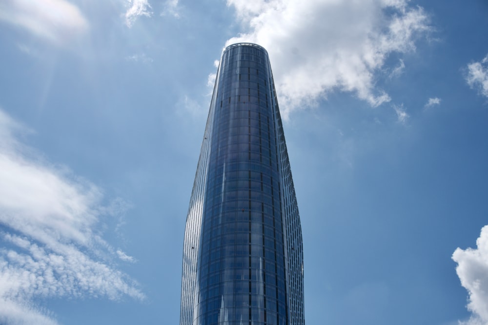 a very tall building with a sky background