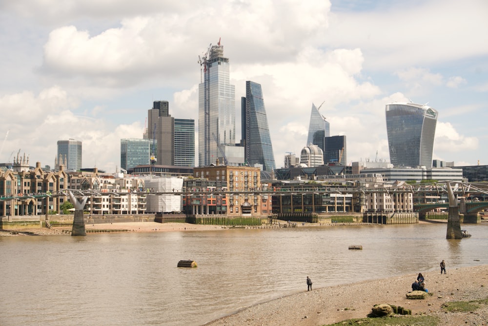 a body of water with a city in the background