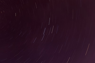 Time-lapse style streaks of light representing hyperspace travel through an endless starfield.