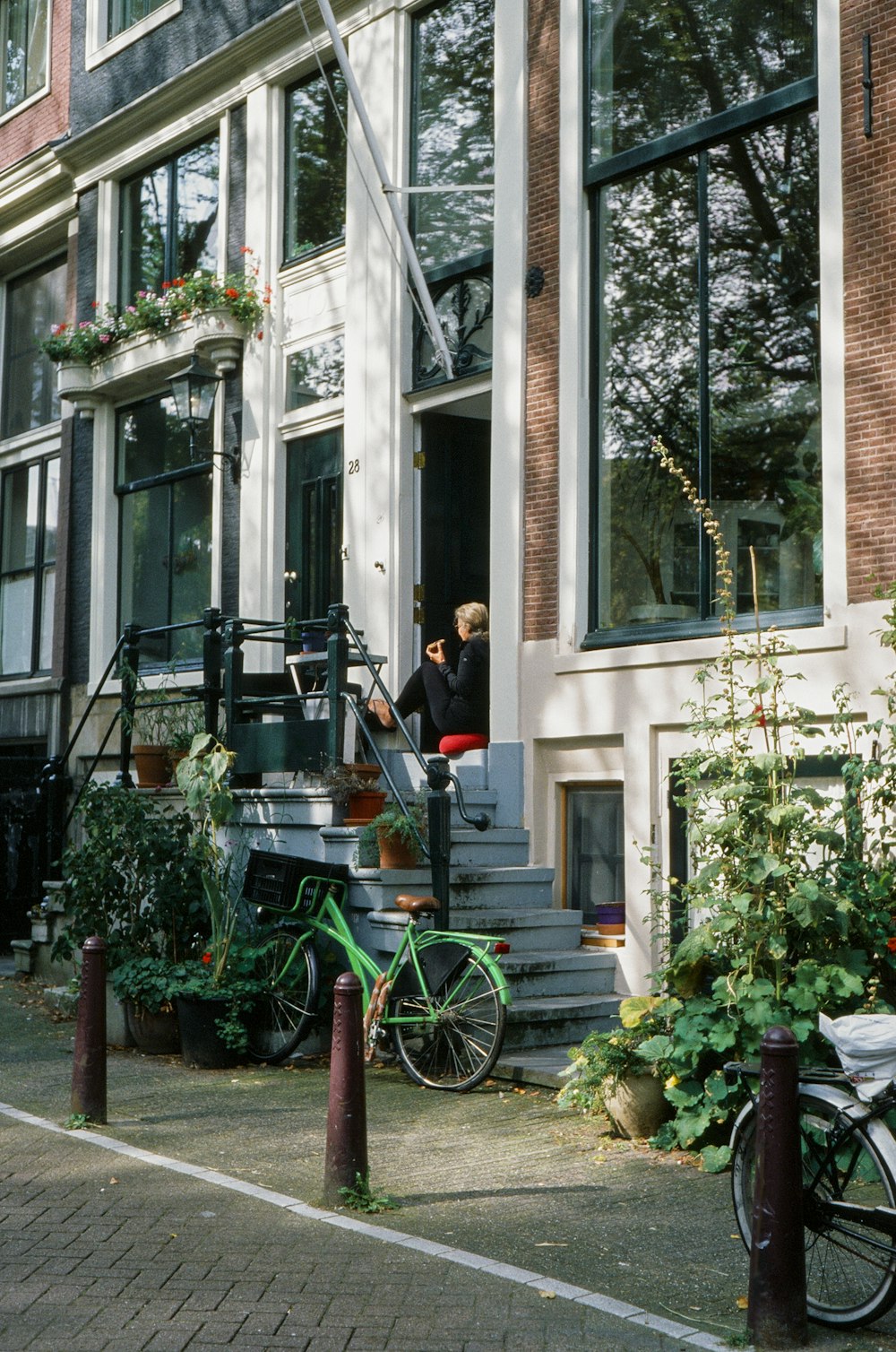 a bicycle parked in front of a tall building