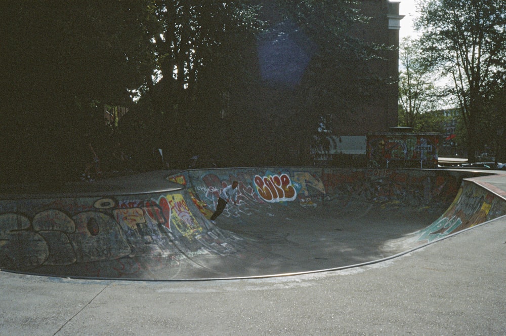 a man riding a skateboard up the side of a ramp