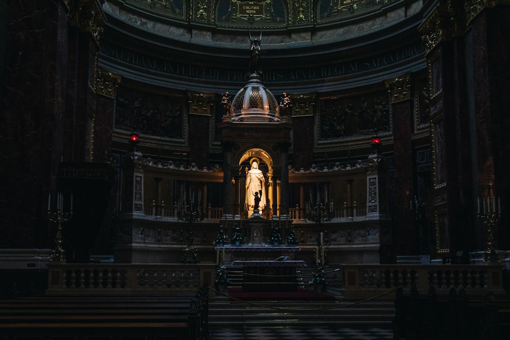 a church with a statue in the middle of it