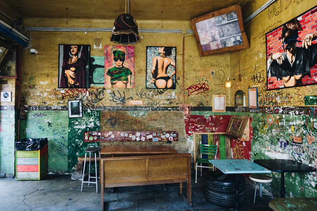 a room that has a bunch of pictures on the wall,